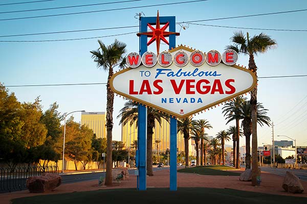 Welcome to Fabulous Las Vegas sign with city backdrop, highlighting courier services