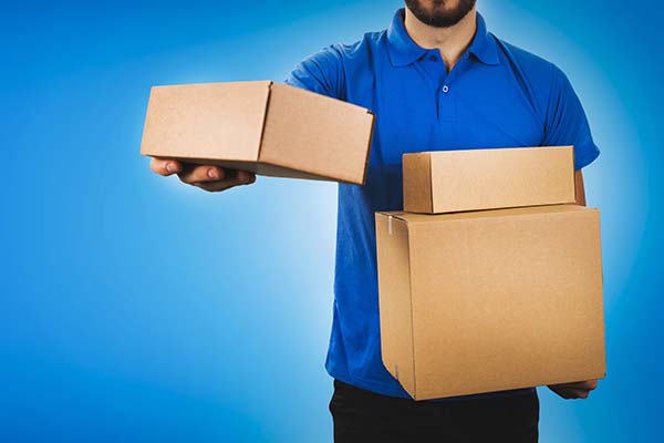 Person holding boxes for Las Vegas delivery services