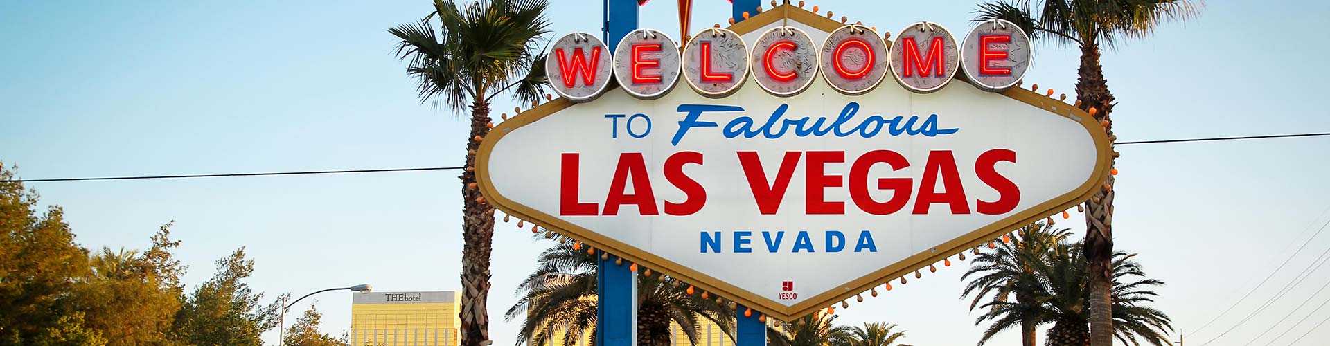 Las Vegas sign with courier service backdrop