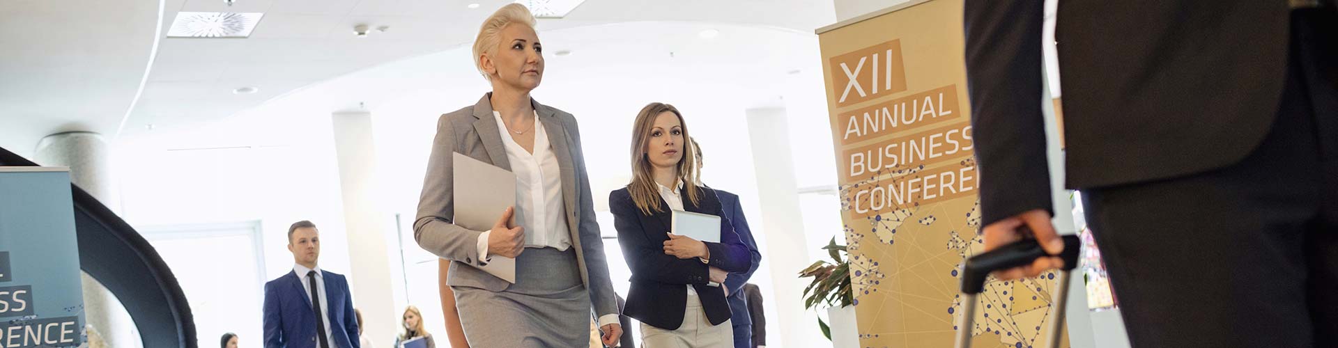 Women walking into an event managed by Majestic Courier